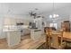 Well-lit kitchen and dining area with wood floors and modern appliances at 1017 Hamilton Ave, Tarpon Springs, FL 34689