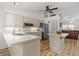 Bright kitchen with white cabinets, stainless steel appliances, and a cozy breakfast bar at 1017 Hamilton Ave, Tarpon Springs, FL 34689