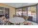 Relaxing screened-in lanai with outdoor seating overlooking the pool at 1017 Hamilton Ave, Tarpon Springs, FL 34689