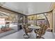 Screened-in lanai featuring outdoor seating, with a view of the pool area at 1017 Hamilton Ave, Tarpon Springs, FL 34689