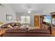 Inviting living room with hardwood floors, comfortable seating, and a view of the front entrance at 1017 Hamilton Ave, Tarpon Springs, FL 34689