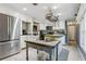 Bright and airy kitchen features stainless steel appliances and an island at 10565 Bessemer St, New Port Richey, FL 34654