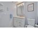 Clean bathroom with modern vanity, updated lighting, and stylish fixtures at 1101 Mclean St, Dunedin, FL 34698