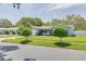 Charming single story home showcasing well-maintained landscaping and a welcoming facade at 1101 Mclean St, Dunedin, FL 34698