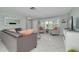 Cozy living room with tile floors, comfortable seating, and bright natural light at 1101 Mclean St, Dunedin, FL 34698