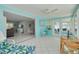 Bright sunroom connected to the living area and dining area, providing ample space at 1101 Mclean St, Dunedin, FL 34698