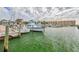 Picturesque waterfront view featuring boats docked at the marina with a view of nearby apartments at 1101 Mclean St, Dunedin, FL 34698