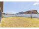 Spacious backyard with white fence providing privacy at 11109 Carrick Stone St, Wimauma, FL 33598