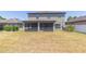 Spacious backyard with screen patio and privacy fence at 11109 Carrick Stone St, Wimauma, FL 33598