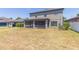 Backyard view featuring screen patio and grass at 11109 Carrick Stone St, Wimauma, FL 33598