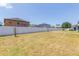 Large backyard enclosed by a white vinyl fence at 11109 Carrick Stone St, Wimauma, FL 33598