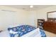 Spacious bedroom features a bed, closet, bookshelf, dresser, and comfortable carpet at 11109 Carrick Stone St, Wimauma, FL 33598