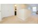 Hallway with carpeted floors and view into bathroom at 11109 Carrick Stone St, Wimauma, FL 33598