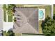 Aerial view of a home showcasing the roof, backyard pool, and surrounding neighborhood at 11845 Newberry Grove Loop, Riverview, FL 33579