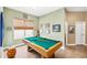 Bright game room with pool table and natural light at 11845 Newberry Grove Loop, Riverview, FL 33579