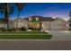 Charming single-story home with manicured lawn and a three-car garage at 11845 Newberry Grove Loop, Riverview, FL 33579