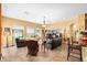 Inviting living room with large windows, stylish furnishings, and tile flooring at 11845 Newberry Grove Loop, Riverview, FL 33579