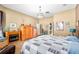 Comfortable main bedroom showcasing a fireplace, tiled floors, and a spacious walk-in closet at 11845 Newberry Grove Loop, Riverview, FL 33579