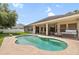 Outdoor pool with patio and covered area offering a relaxing backyard retreat at 11845 Newberry Grove Loop, Riverview, FL 33579