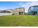 Large backyard with lush green grass, ideal for outdoor activities at 11871 Crestridge Loop, Trinity, FL 34655