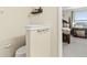 View of the spacious main bedroom beyond the attached half bath at 11871 Crestridge Loop, Trinity, FL 34655
