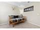 Cozy bedroom featuring a daybed with plaid bedding and a decorative skull at 11871 Crestridge Loop, Trinity, FL 34655