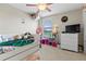 Playful bedroom with a trundle bed, plush sloths, and bright decorations at 11871 Crestridge Loop, Trinity, FL 34655