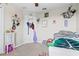 Cheerful bedroom decorated with charming sloth-themed accessories and decor at 11871 Crestridge Loop, Trinity, FL 34655