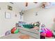 Whimsical bedroom featuring a trundle bed adorned with sloth-themed decor at 11871 Crestridge Loop, Trinity, FL 34655