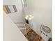 Bright entryway featuring a decorative rug, chandelier, and stylish wall decor at 11871 Crestridge Loop, Trinity, FL 34655