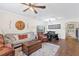 Comfortable living room with a wooden trunk, sofa, and a decorative rug at 11871 Crestridge Loop, Trinity, FL 34655