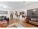 Open living area with an eat-in kitchen and hardwood flooring throughout at 11871 Crestridge Loop, Trinity, FL 34655