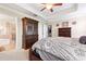 Comfortable main bedroom with ensuite bath and walk-in closet access at 11871 Crestridge Loop, Trinity, FL 34655