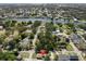 Aerial view of a home near a body of water, surrounded by mature trees at 1209 W Adalee St, Tampa, FL 33603