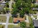 Aerial view of a well-maintained home with mature trees and a spacious driveway at 1209 W Adalee St, Tampa, FL 33603