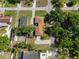 Aerial view of a property with a gazebo, mature trees, and well-kept lawn at 1209 W Adalee St, Tampa, FL 33603