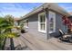 Backyard exterior with an inviting seating area, vibrant plants, and a spacious deck for outdoor enjoyment at 1209 W Adalee St, Tampa, FL 33603