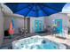 Beautiful backyard deck with a hot tub, comfortable seating, and a colorful flamingo accent at 1209 W Adalee St, Tampa, FL 33603