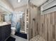 Modern bathroom featuring a stylish vanity and shower, with elegant tiling and fixtures at 1209 W Adalee St, Tampa, FL 33603