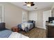 Bedroom with twin beds, wood-look floors, closet, and natural lighting creates a comfortable and inviting atmosphere at 1209 W Adalee St, Tampa, FL 33603