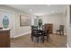 Inviting dining room with hardwood floors, neutral decor, and a bright door and window at 1209 W Adalee St, Tampa, FL 33603
