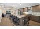 Spacious kitchen featuring a large center island with seating, stainless steel appliances, and modern lighting at 1209 W Adalee St, Tampa, FL 33603