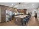 Modern kitchen boasts a large island with seating, stainless steel appliances, and updated fixtures at 1209 W Adalee St, Tampa, FL 33603
