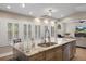 Kitchen island with stone countertops and breakfast bar seating, offering plenty of space at 1209 W Adalee St, Tampa, FL 33603