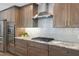 This kitchen features granite counters, stainless appliances and light subway tile at 1209 W Adalee St, Tampa, FL 33603