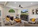Neutral living room featuring a ceiling fan, decor and a large arched window at 1209 W Adalee St, Tampa, FL 33603