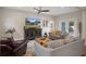 Bright living room with neutral tones, modern decor and a ceiling fan at 1209 W Adalee St, Tampa, FL 33603