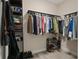 Spacious walk-in closet with ample storage and shelving for shoes, purses, and clothing rod, offering organized convenience at 1209 W Adalee St, Tampa, FL 33603