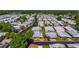 An aerial view shows a community of mobile homes with mature trees at 12501 Ulmerton Rd # 89, Largo, FL 33774