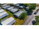 An aerial view shows a mobile home park with well-maintained lawns and streets at 12501 Ulmerton Rd # 89, Largo, FL 33774